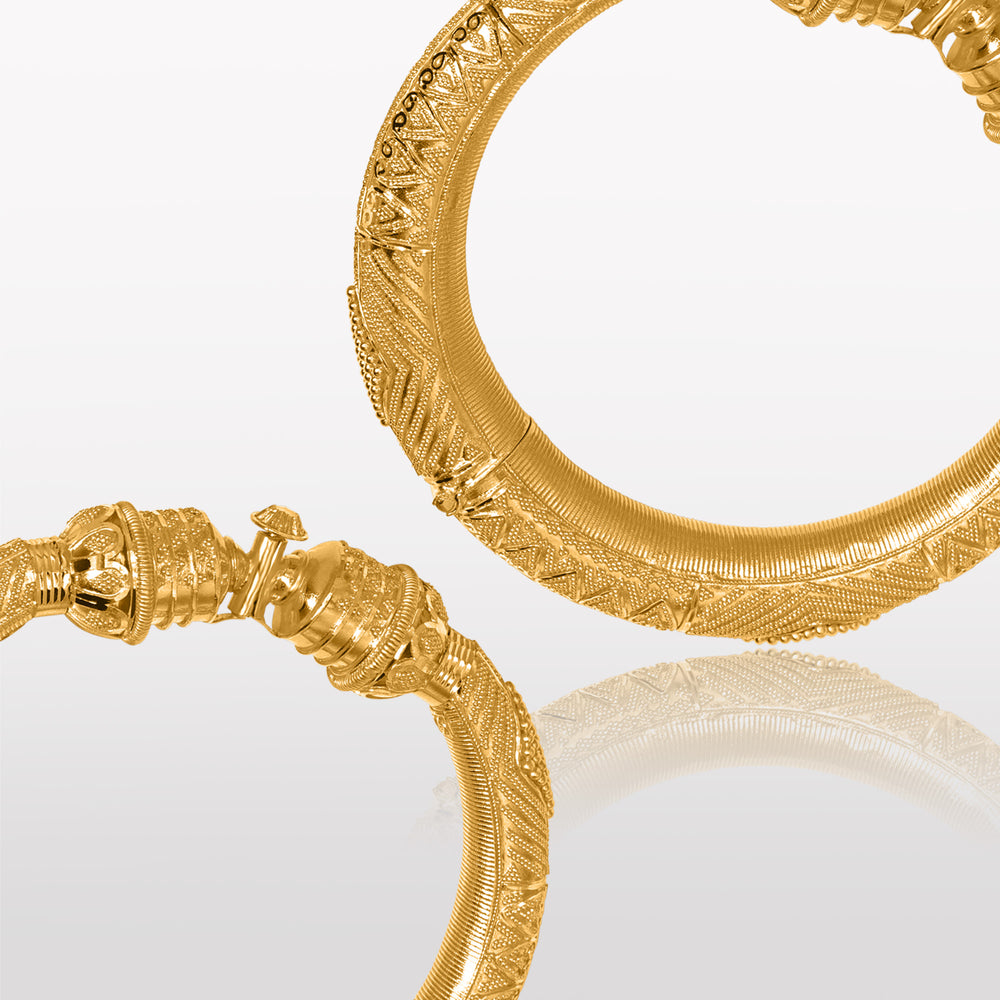 
                  
                    <img src="kimaya-kada-22k-gold.jpg" alt="Kimaya Women's Pair of Kada in 22k Gold - a beautiful image showcasing a pair of traditional Indian bangles, known as kadas, made of 22k gold and featuring intricate designs and a stunning, glossy finish."/>
                  
                